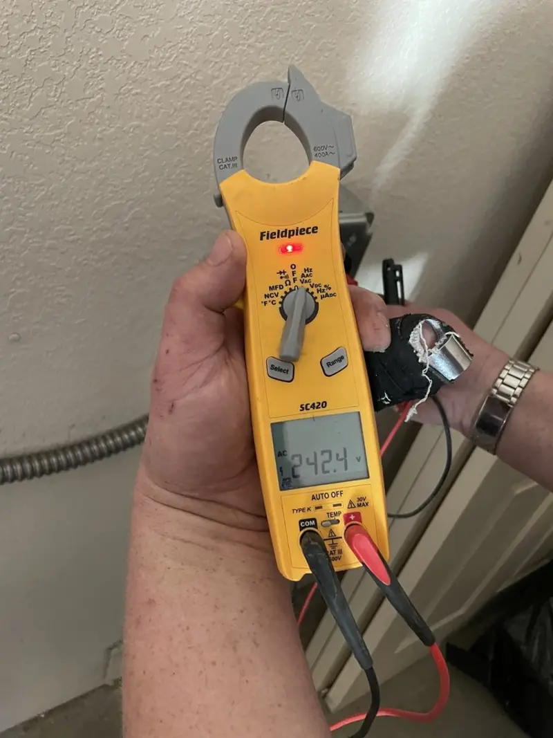 Voltage testing with clamp meter during Electrical Installation Services in McKinleyville